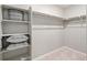 Spacious walk-in closet with shelving and ample storage at 9876 Ceylon Ct, Commerce City, CO 80022