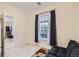 Cozy bedroom featuring neutral walls, tiled floors, and lots of bright natural light at 2831 W Irvington Pl, Denver, CO 80219