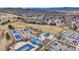 Overhead view of the park showing tennis courts, baseball fields, playground, picnic, and parking areas at 4678 Springmeadow Ln, Castle Rock, CO 80109