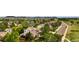 Aerial view showcasing the home nestled among lush landscaping and a well-maintained neighborhood at 4678 Springmeadow Ln, Castle Rock, CO 80109