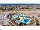 Overhead view of community pools, a playground, picnic pavilions, and outdoor spaces at 4678 Springmeadow Ln, Castle Rock, CO 80109