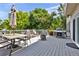 Enjoyable back deck featuring a built-in grill, patio table, fire pit, and backyard views at 4678 Springmeadow Ln, Castle Rock, CO 80109