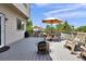 Wonderful back deck with table, chairs, rocking chair, fire pit, and backyard views at 4678 Springmeadow Ln, Castle Rock, CO 80109