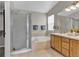 Bathroom featuring a shower, soaking tub, and single vanity sink at 4678 Springmeadow Ln, Castle Rock, CO 80109