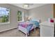 Comfortable bedroom with a ceiling fan and natural light streaming through the window at 4678 Springmeadow Ln, Castle Rock, CO 80109