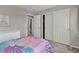 Bedroom with carpet, closet, and access to a bathroom at 4678 Springmeadow Ln, Castle Rock, CO 80109