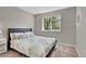 Bedroom with a patterned bedspread and a window with natural light at 4678 Springmeadow Ln, Castle Rock, CO 80109