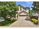 Two-story home featuring a two-car garage and well-maintained front yard at 4678 Springmeadow Ln, Castle Rock, CO 80109