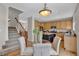Cozy kitchen and dining area with stainless steel appliances and a central island at 4678 Springmeadow Ln, Castle Rock, CO 80109