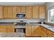 Spacious kitchen featuring stainless steel appliances and granite countertops at 4678 Springmeadow Ln, Castle Rock, CO 80109