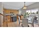 Bright kitchen with hardwood floors, stainless steel appliances and access to the deck at 4678 Springmeadow Ln, Castle Rock, CO 80109