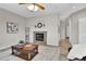 Inviting living room showcasing a fireplace, stylish decor, and a spacious layout with wood flooring at 4678 Springmeadow Ln, Castle Rock, CO 80109