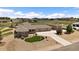 Expansive property featuring a sprawling lawn, white picket fence, and a home with an attached three-car garage at 12590 Valentia St, Thornton, CO 80602