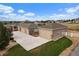 Beautiful exterior aerial view of home with a long driveway, oversized garages, and an expansive, well-maintained lot at 12590 Valentia St, Thornton, CO 80602