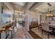 Welcoming entryway with hardwood floors, high ceilings, and views into the living and dining spaces at 12590 Valentia St, Thornton, CO 80602