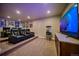 Home theater features tiered seating with leather recliners, large screen tv, and concession stand at 12590 Valentia St, Thornton, CO 80602