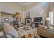 Spacious living room boasting high ceilings, fireplace, and ample seating at 12590 Valentia St, Thornton, CO 80602