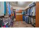 Spacious walk-in closet with custom shelving and organization system at 12590 Valentia St, Thornton, CO 80602