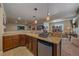Finished basement wet bar with granite countertops, beverage cooler, and open layout to the living space at 12590 Valentia St, Thornton, CO 80602