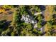 Aerial shot of a home surrounded by a dense forest at 60 Glenalla Pl, Castle Rock, CO 80108