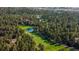 Serene aerial view of a sprawling golf course with trees and ponds at 60 Glenalla Pl, Castle Rock, CO 80108