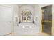 Bright bathroom featuring a soaking tub under a large window, and a glass shower at 60 Glenalla Pl, Castle Rock, CO 80108