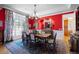 Elegant dining room with large windows and a decorative chandelier at 60 Glenalla Pl, Castle Rock, CO 80108