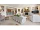 Spacious living room featuring a fireplace, a bar area, and comfortable seating at 60 Glenalla Pl, Castle Rock, CO 80108