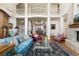 Spacious living room with a balcony view, fireplace, and classic interior design at 60 Glenalla Pl, Castle Rock, CO 80108
