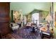 Cozy sitting room with fireplace, decorative mirror, and comfortable seating at 60 Glenalla Pl, Castle Rock, CO 80108