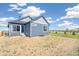 Exterior view of a blue home with a good sized backyard at 9265 Cathay Ct, Commerce City, CO 80022