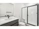 Modern bathroom with a glass shower and black hardware at 9265 Cathay Ct, Commerce City, CO 80022