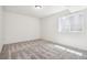 Bright, carpeted bedroom with a single window and neutral paint at 9265 Cathay Ct, Commerce City, CO 80022
