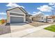 Single Gathering home with attached two car garage and long driveway at 9265 Cathay Ct, Commerce City, CO 80022