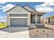 Single Gathering home with attached two car garage, landscaped yard and covered porch at 9265 Cathay Ct, Commerce City, CO 80022