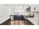 Kitchen with stainless appliances, dishwasher and gas range cooktop overlooking living room at 9265 Cathay Ct, Commerce City, CO 80022