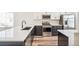Bright kitchen with stainless appliances, dishwasher and gas range cooktop at 9265 Cathay Ct, Commerce City, CO 80022