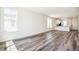 Bright living room with wood floors, large windows and open layout at 9265 Cathay Ct, Commerce City, CO 80022