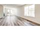 Bright living room with light gray floors and a large window at 9265 Cathay Ct, Commerce City, CO 80022