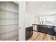 Walk-in pantry with custom shelving for organized storage in the kitchen at 9265 Cathay Ct, Commerce City, CO 80022