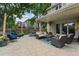 Spacious outdoor patio perfect for entertaining, featuring a comfortable seating area and manicured landscaping at 5766 S Fulton Way, Greenwood Village, CO 80111