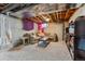 Inviting finished basement featuring a cozy seating area, plush carpet, and open ceiling at 5766 S Fulton Way, Greenwood Village, CO 80111