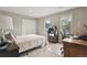 Cozy bedroom featuring natural light, neutral tones, carpet and ample closet space for comfortable living at 5766 S Fulton Way, Greenwood Village, CO 80111