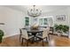 Elegant dining room with a modern chandelier, hardwood floors, and ample space for entertaining at 5766 S Fulton Way, Greenwood Village, CO 80111