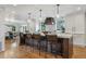 Bright kitchen with marble counters, decorative backsplash and large island with seating at 5766 S Fulton Way, Greenwood Village, CO 80111