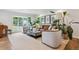 Inviting living room with stylish decor, comfortable seating, and large windows offering natural light at 5766 S Fulton Way, Greenwood Village, CO 80111
