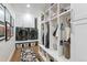 Well-organized mudroom with washer, dryer, custom lockers, and ample storage for modern Gathering living at 5766 S Fulton Way, Greenwood Village, CO 80111