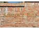 A brick monument sign reading Sundance Hills in an attractive, earthy color palette at 5766 S Fulton Way, Greenwood Village, CO 80111
