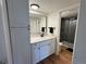 Updated bathroom featuring modern vanity, sink, and stylish mirror, creating a clean aesthetic at 10785 W 63Rd Pl # 108, Arvada, CO 80004