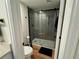 Sleek bathroom with a new glass shower door and updated fixtures, creating a modern and inviting space at 10785 W 63Rd Pl # 108, Arvada, CO 80004